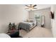 Cozy bedroom with a plush bed, window view, and stylish decorative items at 488 Kistler Cir, Clermont, FL 34715