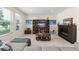 Bright living room with a fireplace, entertainment center, and lots of light at 488 Kistler Cir, Clermont, FL 34715