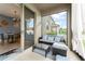 Covered patio featuring comfortable seating and view of backyard and dining area at 488 Kistler Cir, Clermont, FL 34715
