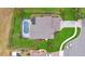 Aerial view of a home with screened in pool and backyard at 518 Glen Grove Ln, Orlando, FL 32839