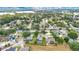 Aerial view of a neighborhood with water view of the lake at 518 Glen Grove Ln, Orlando, FL 32839