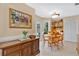 Cozy breakfast nook with round table, surrounded by cabinets and a view of the outside at 518 Glen Grove Ln, Orlando, FL 32839