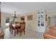 Formal dining room with chandelier, traditional furniture, and access to the outdoor patio at 518 Glen Grove Ln, Orlando, FL 32839