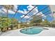 Sparkling pool surrounded by a screened enclosure, providing a private and relaxing outdoor space at 518 Glen Grove Ln, Orlando, FL 32839
