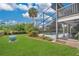 Screened in pool area and lush landscaping at 518 Glen Grove Ln, Orlando, FL 32839
