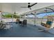 Inviting screened porch with comfortable seating and ceiling fans for relaxing outdoors at 518 Glen Grove Ln, Orlando, FL 32839