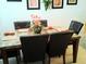 Dining room with a marble table, seating for six, and decorative centerpiece at 5276 Cane Island Loop # 302, Kissimmee, FL 34746