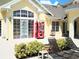 Relaxing lounge area with deck chairs, a soda machine, and landscaped greenery at 5276 Cane Island Loop # 302, Kissimmee, FL 34746