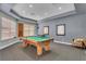 Game room with a pool table, seating, and natural light at 5276 Cane Island Loop # 302, Kissimmee, FL 34746