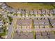 Aerial view of modern townhomes showing well-kept lawns and community street layout at 6132 Bimini Twist Loop, Orlando, FL 32819