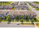 Aerial view of modern townhomes boasts manicured lawns and a well-planned community layout at 6132 Bimini Twist Loop, Orlando, FL 32819