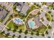 Community aerial view showing pool, playground, and well-maintained common areas, ideal for Gathering fun and relaxation at 6132 Bimini Twist Loop, Orlando, FL 32819