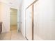Tiled bathroom showcasing a glass shower and adjacent walk-in closet at 6132 Bimini Twist Loop, Orlando, FL 32819