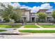 Charming townhomes featuring well-kept lawns, symmetrical landscaping, and inviting entrances at 6132 Bimini Twist Loop, Orlando, FL 32819