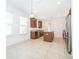 Well-lit kitchen offers stainless steel appliances, center island, granite counters, and ample cabinet space at 6132 Bimini Twist Loop, Orlando, FL 32819