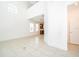 Bright living room showcasing neutral color palette and an open layout connecting to the kitchen at 6132 Bimini Twist Loop, Orlando, FL 32819