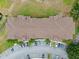 Bird's eye view shows an expansive brown roof of a condo building with parking and green space surrounding it at 621 Terrace Ridge Cir # 621, Davenport, FL 33896