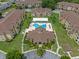 Overhead view of condo community with clubhouse, pool and other buildings, with green space surrounding the community at 621 Terrace Ridge Cir # 621, Davenport, FL 33896