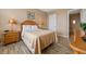 Cozy bedroom featuring a neutral color palette, wood-look flooring and ample natural light at 621 Terrace Ridge Cir # 621, Davenport, FL 33896