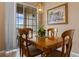 Classic dining room featuring an ornate table, chairs, and sliding glass doors at 621 Terrace Ridge Cir # 621, Davenport, FL 33896