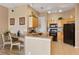 Bright kitchen with tile floors, wood cabinets, and appliances at 621 Terrace Ridge Cir # 621, Davenport, FL 33896