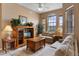 Inviting living room with comfortable seating and natural light from large windows at 621 Terrace Ridge Cir # 621, Davenport, FL 33896