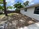 This backyard features a fenced perimeter and partially shaded grass at 6624 Kristin Ct, Orlando, FL 32818