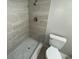 This bathroom features a modern shower with gray tiling and a white toilet at 6624 Kristin Ct, Orlando, FL 32818