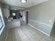 Dining room with a view into the kitchen, and featuring tile flooring at 6624 Kristin Ct, Orlando, FL 32818