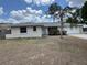 Charming single-story home with a well-manicured lawn and mature landscaping at 6624 Kristin Ct, Orlando, FL 32818