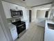 Updated kitchen featuring stainless steel appliances and modern countertops and cabinets at 6624 Kristin Ct, Orlando, FL 32818