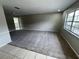 Bright living area features neutral tones and a mix of tiled and carpet flooring at 6624 Kristin Ct, Orlando, FL 32818