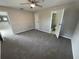 Carpeted main bedroom with attached bathroom at 6624 Kristin Ct, Orlando, FL 32818
