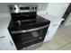 Close-up of a stainless steel oven with a glass cooktop and quartz countertops at 6624 Kristin Ct, Orlando, FL 32818