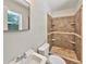 Bathroom with tiled shower, updated fixtures, and vanity sink at 7614 Sw 80Th St, Ocala, FL 34476