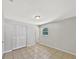 Bedroom features tile floor, closet, and an ensuite bathroom at 7614 Sw 80Th St, Ocala, FL 34476