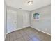 This bedroom features a closet, tile floor, and window at 7614 Sw 80Th St, Ocala, FL 34476