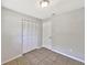 Bedroom features tile floor, closet, and white door at 7614 Sw 80Th St, Ocala, FL 34476