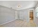 Bedroom featuring tile floor, closet, door, and access to an ensuite bathroom at 7614 Sw 80Th St, Ocala, FL 34476