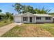 Charming single-story home with a well-maintained front lawn and attached garage at 7614 Sw 80Th St, Ocala, FL 34476