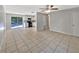 Open-concept living room with tile floors, seamlessly connected to the kitchen at 7614 Sw 80Th St, Ocala, FL 34476