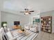 Inviting living room featuring tile floors, ceiling fan, and modern furnishings at 7614 Sw 80Th St, Ocala, FL 34476