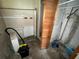 Unfinished basement features a closet and a variety of plumbing at 825 Poinsettia Dr, Eustis, FL 32726