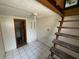 Basement with stairs and a door to a storage area at 825 Poinsettia Dr, Eustis, FL 32726