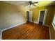 Bedroom with hardwood floors, a ceiling fan, and two closets at 825 Poinsettia Dr, Eustis, FL 32726