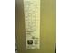 Image shows the model and serial number of an outdoor HVAC unit at 825 Poinsettia Dr, Eustis, FL 32726