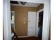 Hallway with wood floors and doors leading to other rooms at 825 Poinsettia Dr, Eustis, FL 32726