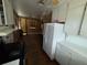 Bright kitchen features white cabinets, an electric stove top, and hardwood floors at 825 Poinsettia Dr, Eustis, FL 32726