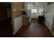 Classic kitchen features white cabinets, appliances, and a window above the sink for natural light at 825 Poinsettia Dr, Eustis, FL 32726