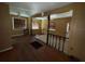 Split level living room featuring hardwood floors and natural light at 825 Poinsettia Dr, Eustis, FL 32726